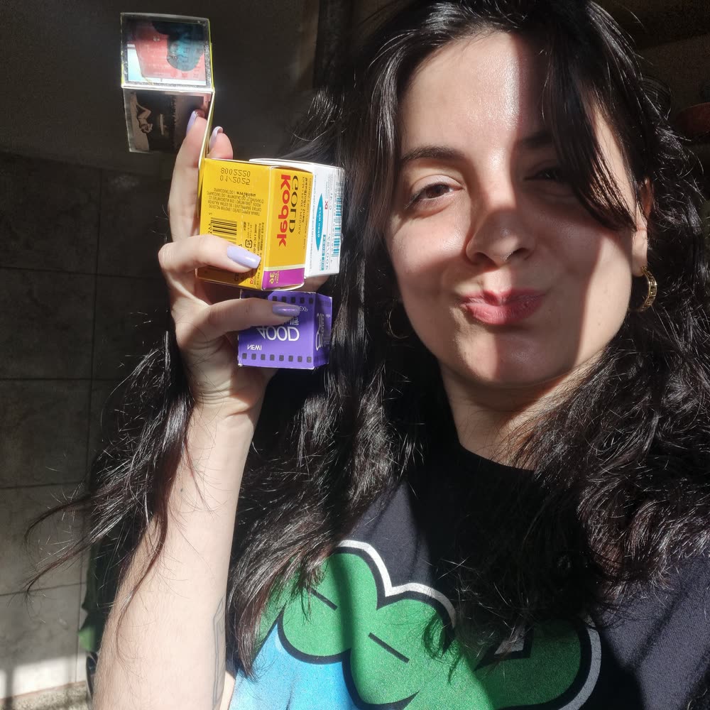 Holding up boxes of film, Kodak and Cinestill